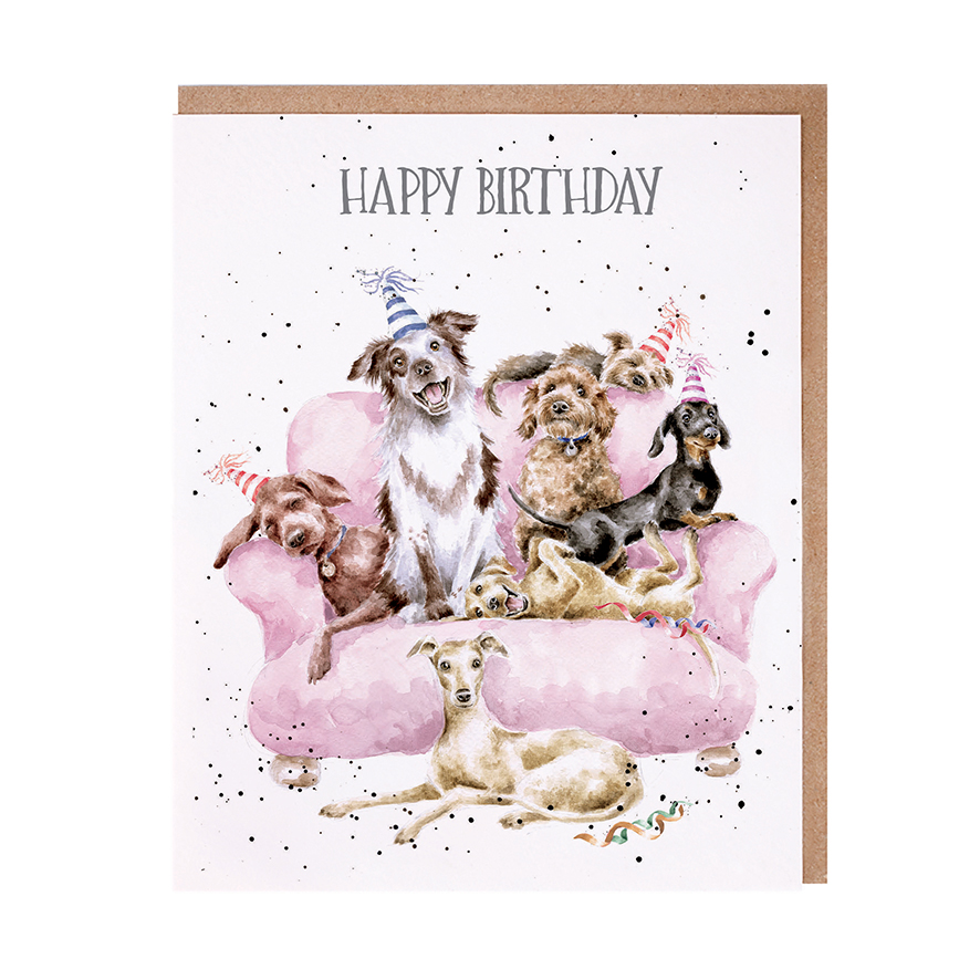 Dogs with party hats on a pink sofa birthday card
