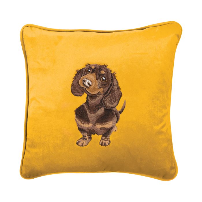 Embroidered dachshund cushion on yellow fabric