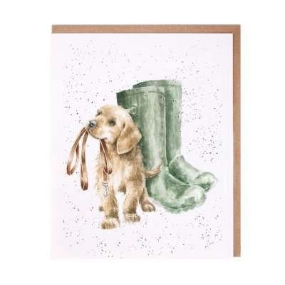 puppy with a lead in its mouth next to green wellies greeting card