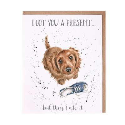Puppy with a chewed trainer birthday card