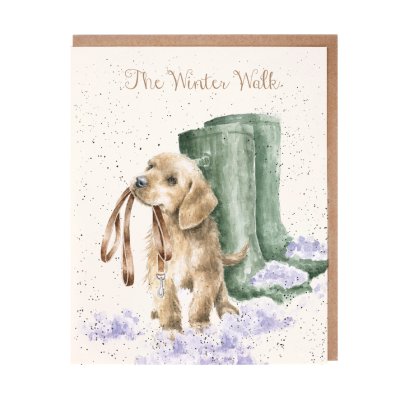 Labrador puppy with a lead in its mouth next to green wellies Christmas card
