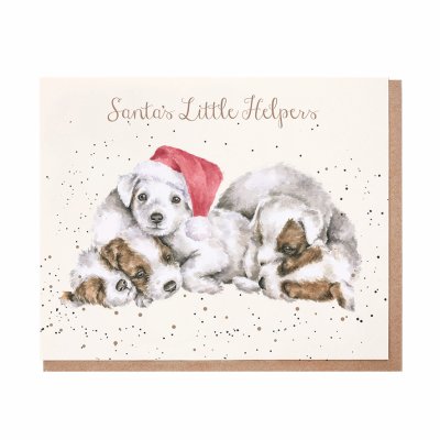 Pile of white and brown puppies one with a Santa hat Christmas card