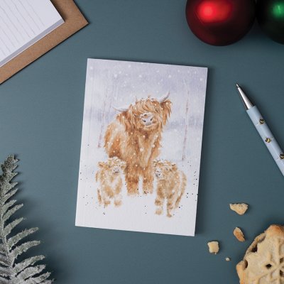 3 fluffy highland cows in the christmas snow on an A6 paperback notebook